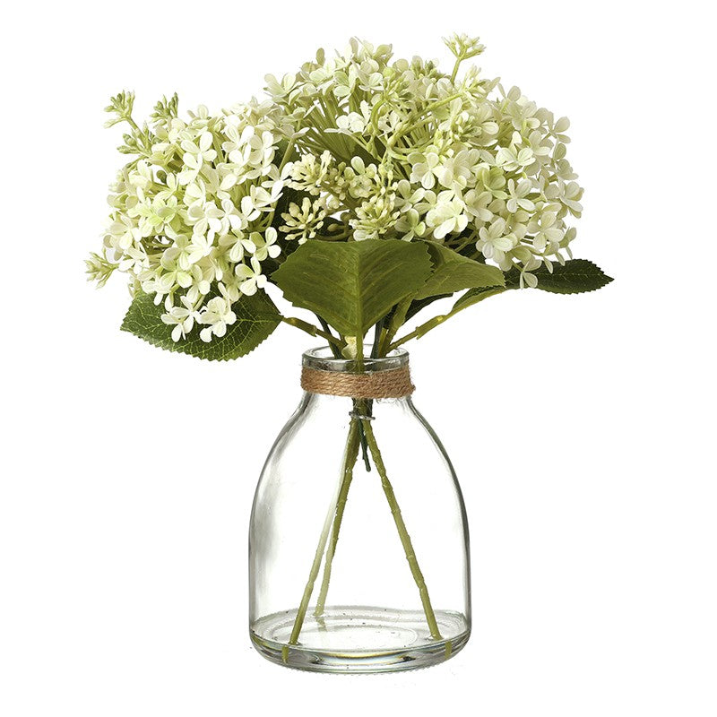 Small White Flowers Bunch in Clear Glass Vase