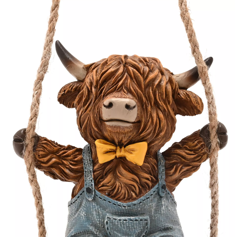 Country Living Highland Cow On A Swing