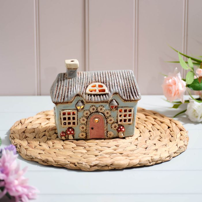Light Blue Stoneware House with Mushrooms and Daisy Door Garland Candle Holder