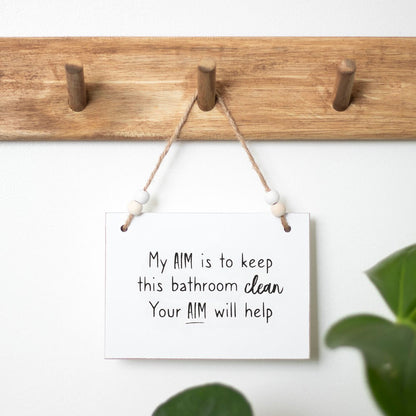Comical 'Your Aim' Hanging Sign