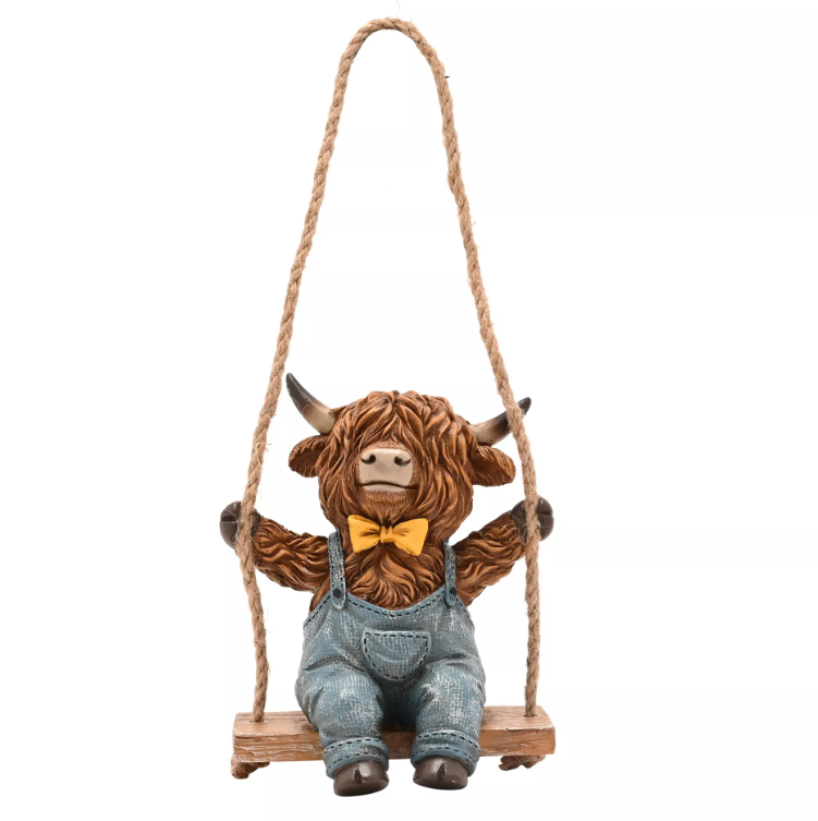 Country Living Highland Cow On A Swing